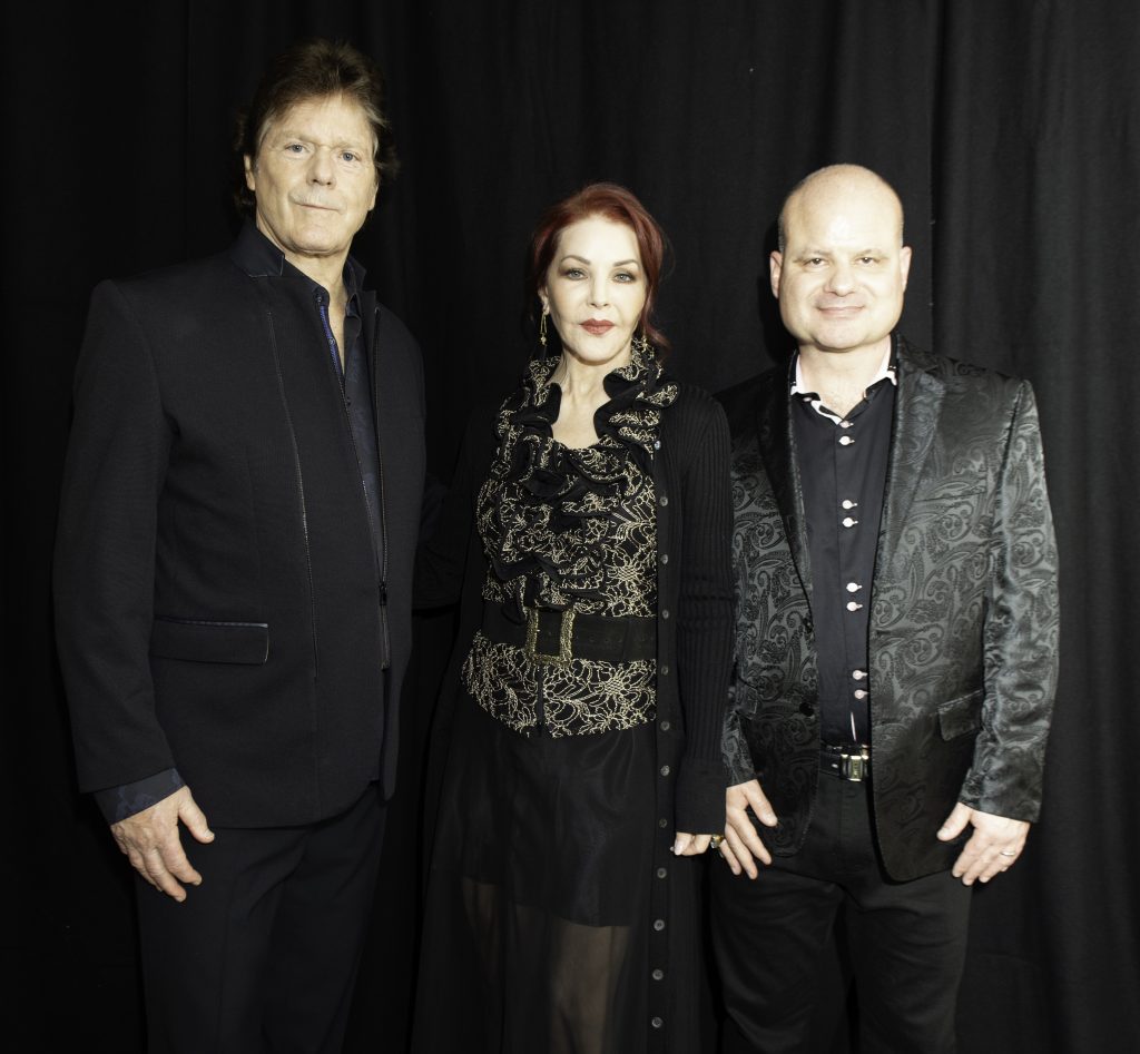 J K Mullins, author of "Memories of an Elvis fan" and founder of The Book Hook, with Priscilla Presley & Jerry Schilling in 2019.