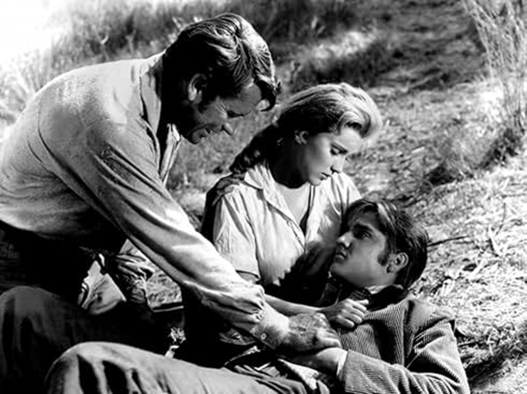 Clint Reno dies with Vance (Richard Egan) and Cathy attempting to comfort him.