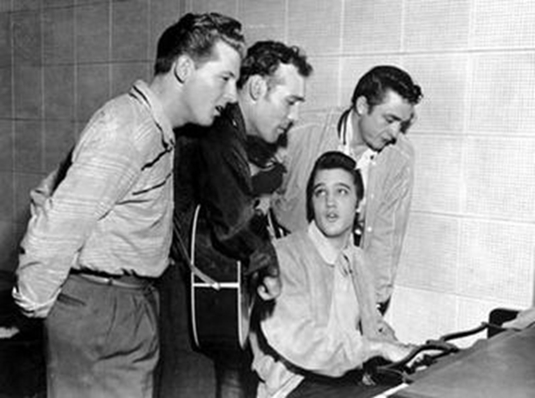 The Million Dollar Quartet, from left to right, Jerry Lee Lewis, Carl Perkins, Elvis, and Johnny Cash.