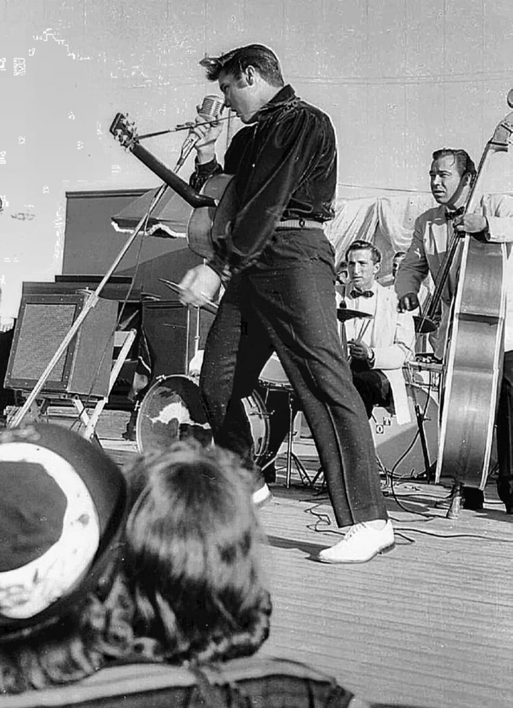Bill Black and D. J. Fontana take direction from Elvis’ on-stage movements.