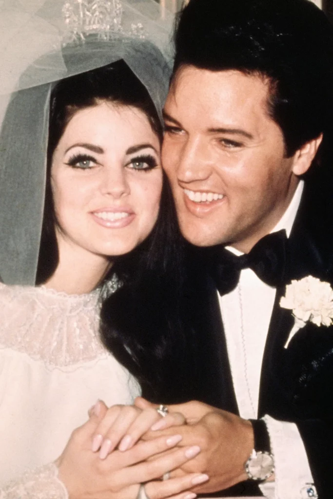 Elvis and Priscilla, post-wedding press conference.
