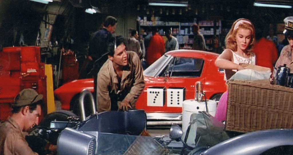 While preparing the race car, the crew is interrupted by Rusty, who brings a hamper of food for her father. Seen from Viva Las Vegas.